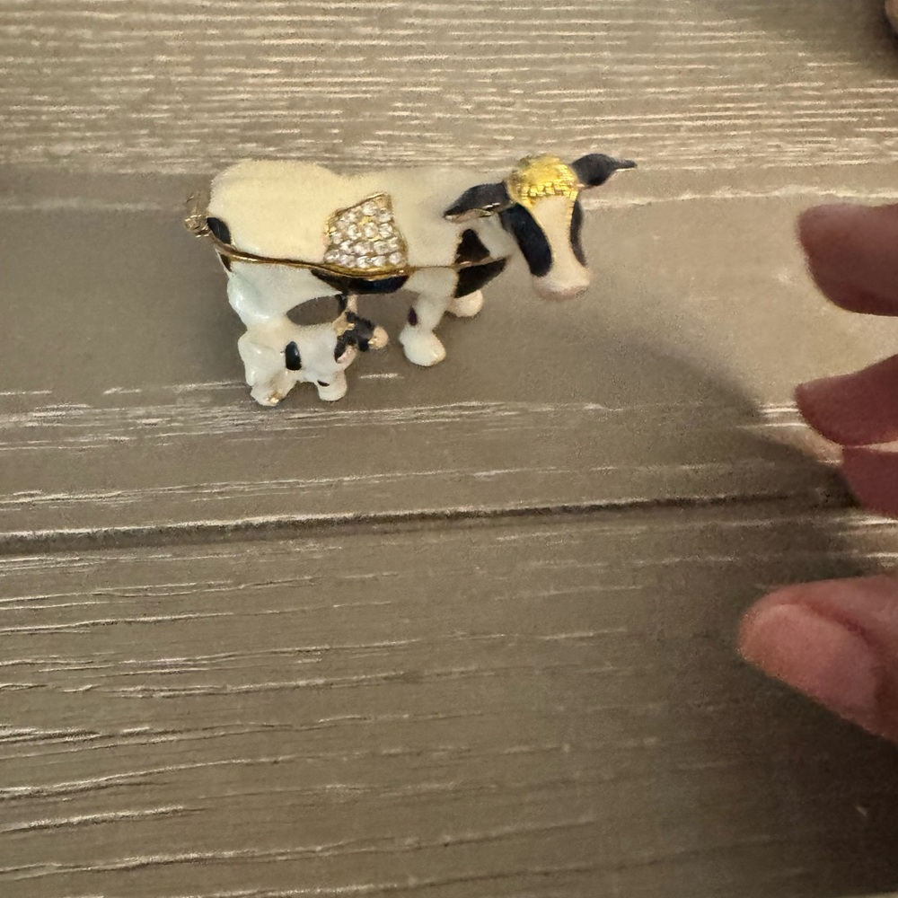 Black and White Cow Figurine with Gold Accents